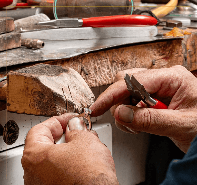 Hands crafting jewelry piece